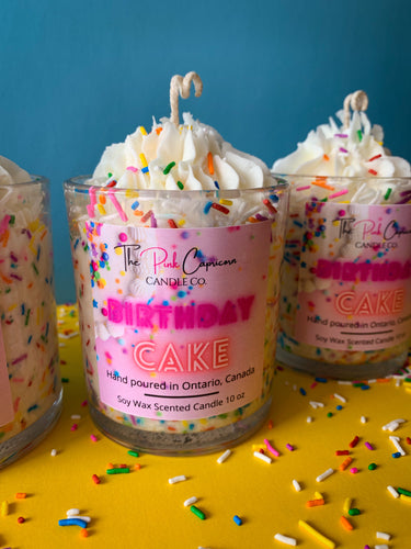 birthday cake candle with whipped cream frosting and sprinkles